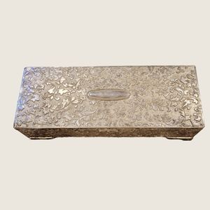 Vintage silver jewlery box with burgundy red trim.